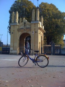 Rental Bike Posing for a Picture in Front of Stadium Entrance in Parma