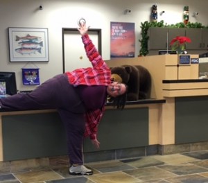 Practicing the half moon pose in a several hour meeting at the bank.  
